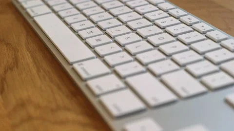 Typing on macbook pro keyboard Stock Footage 64047687