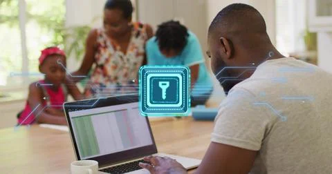 Typing man in gray tee using laptop at home with mug and security icon, copy 스톡 사진