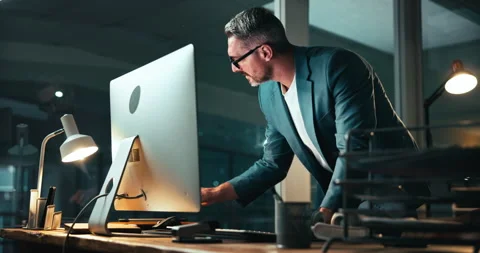 Typing, mature man and computer with feedback for coding, programing and Stock Footage 301389661