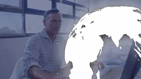 Typing mature man wearing printed shirt using mouse at computer in bright office Stock Footage 332821682