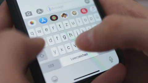 Typing message on iPhone: can you come over at 12? [6K30] Stock-Footage 127633775