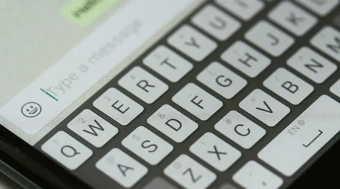 Typing message on mobile phone  i miss you Video stock 64325708