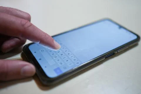 Typing a message on a phone Stock-Fotos