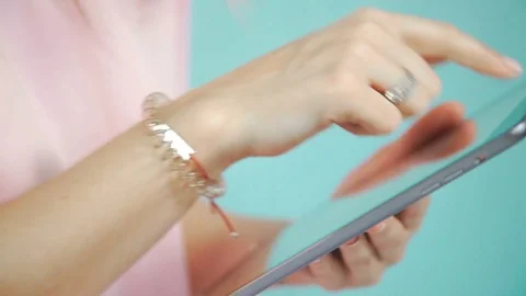 Typing messages on the touch screen of the tablet. Engagement ring Stock-Footage 76434810