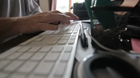 Typing on a messy desk Stock Footage 8963889