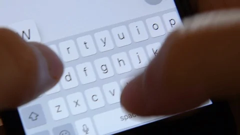 Typing on a mobile phone Stock Footage 92615406