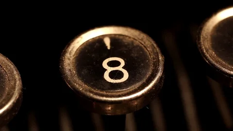 Typing number 8 on vintage typewriter Stock Footage 78990997