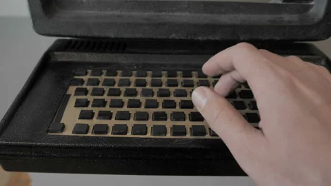 Typing On An Old Computer With One Hand Stock Footage 153399215