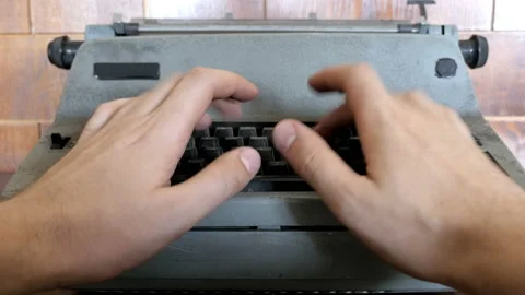 Typing on old electrical typewriter Stock Footage 96002378
