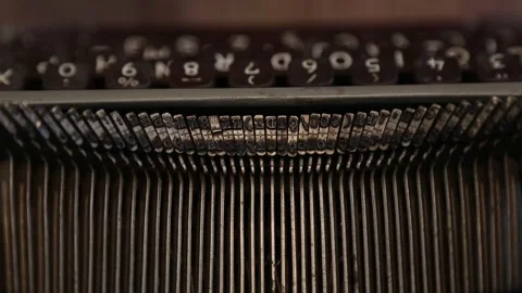 Typing on an old vintage typewriter. Typebar letter stamps close up. Stock Footage 338028035