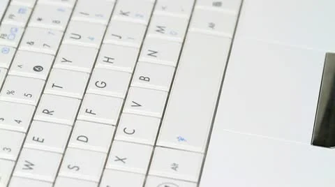 Typing out on a small white laptop Stock Footage 9785556