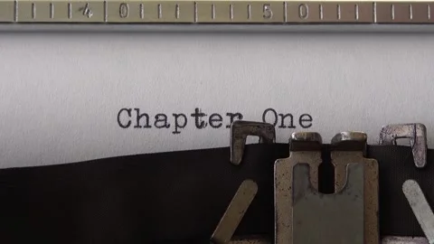 Typing phrase Chapter One on retro typewriter. Close up. Video stock 161074552