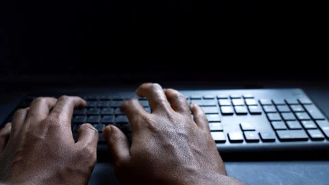 Typing point of view shot with dark blue background 4k Stock Footage 121705099