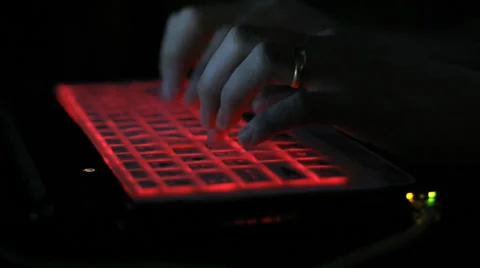 Typing on red keyboard laptop Stock Footage 35551778