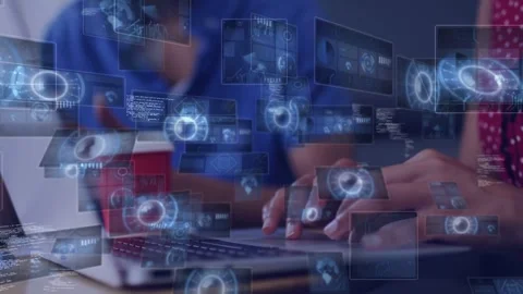 Typing red polka-dot blouse entering laptop data at table, blue shirt checking Stock Footage 336714120