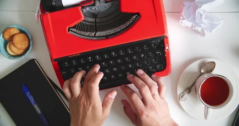 Typing on red typewriter with tea Stock Footage 317166447