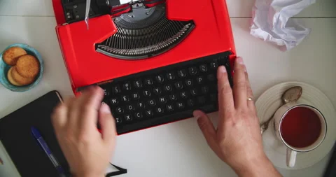 Typing on red typewriter with tea Stock Footage 317166557
