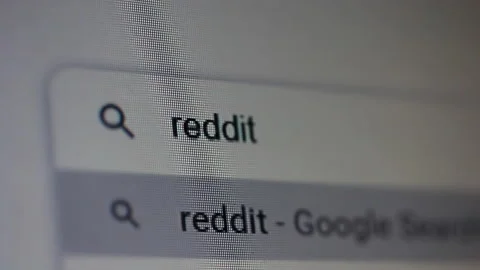 Typing Reddit into Browser Search Field on Computer Display Stock Footage 150758416
