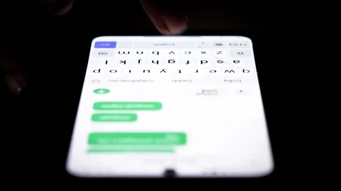 Typing repeated messages on a smartphone for spam messaging Stock Footage 340121039