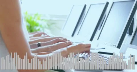 Typing row of hands tapping keys at office desk by window, short sleeves, watch, Stock Photos