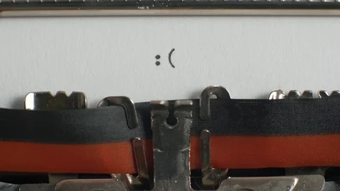 Typing sad emoticon on typewriter Stock Footage 87351401