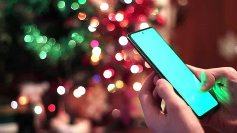 Typing On Smartphone With Christmas Tree Stock Footage 227352433