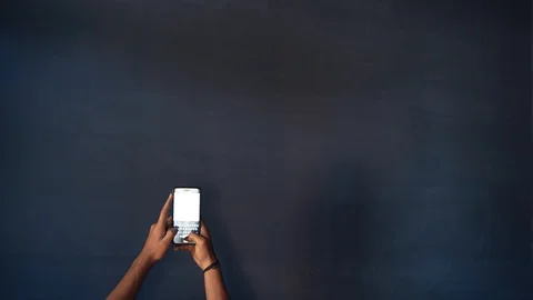 Typing on smartphone with dark background and copyspace Stock Footage 127968161