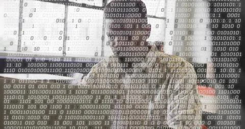 Typing software developer entering code on computer at desk in office, with b 스톡 사진