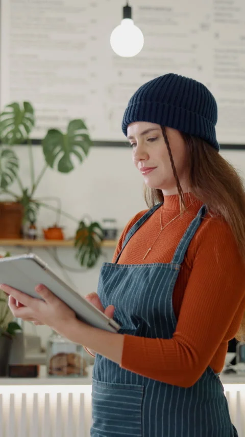 Typing, tablet and waiter in coffee shop for online menu, inventory checklist Stock Footage 340449547