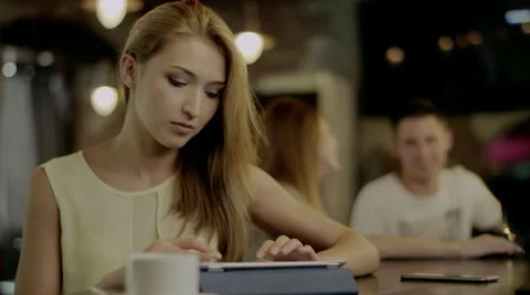 Typing on tablet in a cafe Stock Footage 67879329