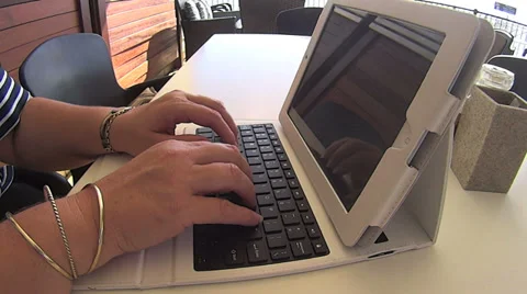 Typing On Tablet At Coffee Shop Stock Footage 35885496
