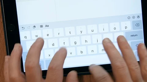 Typing on a tablet mobile device Stock Footage 92620383