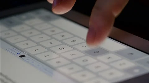 Typing on tablet virtual keypad, 4K UHD Stock Footage 45140930