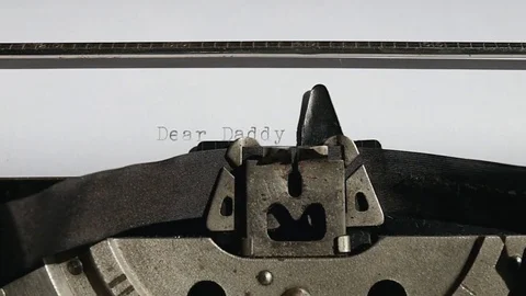 Typing text "Dear Daddy," on white paper Video stock 75209125