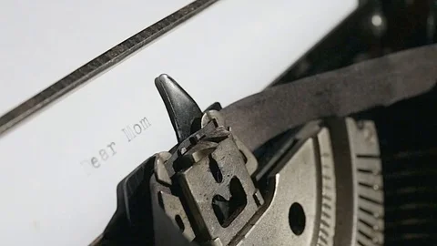 Typing text "Dear Mom" on white paper Stock Footage 75207757