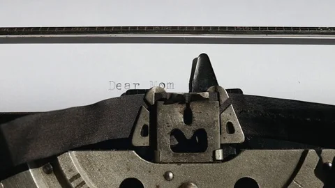 Typing text "Dear Mom" on white paper Stock Footage 75208907