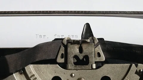 Typing text "Far, far away ..." on white paper Stock Footage 75209629