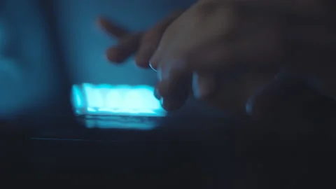 Typing text on laptop keyboard. Work on laptop at night, blue light. Macro. Stock Footage 151619721