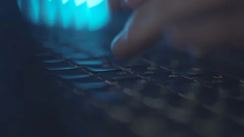 Typing text on laptop keyboard. Work on laptop at night, blue light. Macro. Stock-Footage 151679395