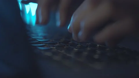 Typing text on laptop keyboard. Work on laptop at night, blue light. Macro. Video stock 151679413