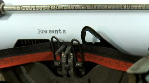 Typing a text on an old typewriter: Presents Stock Footage 23657193
