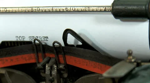 Typing a text on an old typewriter: TOP SECRET Stock Footage 23588691