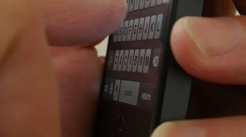 Typing on a touch screen cell phone - iPhone 5 Video stock 24651596