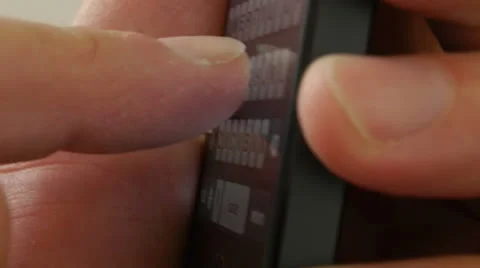 Typing on a touch screen cell phone - iPhone 5 Stock Footage 24651807