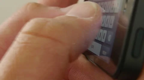 Typing on a touch screen cell phone - iPhone 5 Stock Footage 24652039