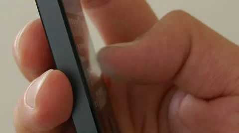 Typing on a touch screen cell phone - iPhone 5 Stock Footage 24652313
