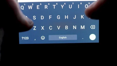 Typing on a touchscreen in darkness closeup Stock Footage 84305678