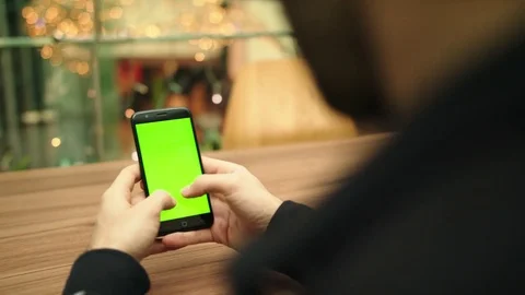 Typing on a touchscreen keyboard on a smartphone green screen chroma key mall Stock Footage 84688661