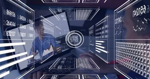 Typing, two men in blue and dark shirts using laptop with circular holographic Stock Photos