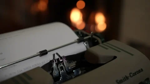 Typing on typewriter with fireplace Stock Footage 262452619